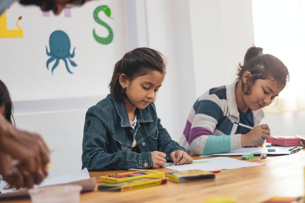 Young girls doing class work